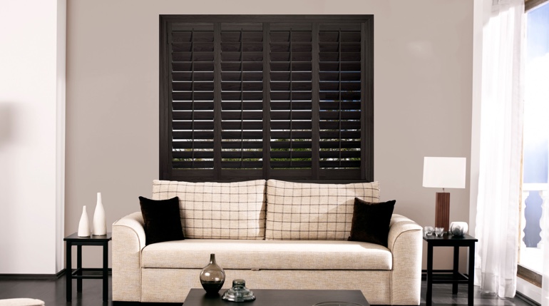 Honolulu sitting room with plantation shutters.